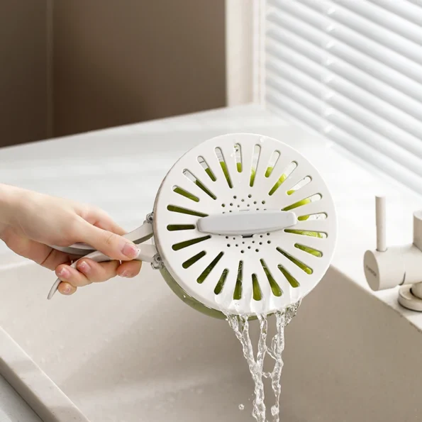 Égouttez et faites tremper facilement avec ce bol de drainage multifonctionnel, simplifiant la préparation des aliments et le nettoyage en un seul outil pratique