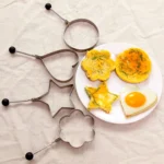 kf-Sb6b05979e36744e0944b1a8898c8adf1f-5Pcs-Stainless-Steel-Eggs-Rings-Mold-With-Handle-Round-Non-stick-Pancake-Omelette-Mold-For-Griddle